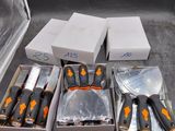 many knives and knives in a box on a table