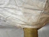 a large white pillow on top of a metal object