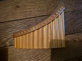 a close up of a musical instrument on a wooden table