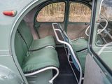 two seats in the back of a green car