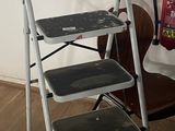 three step stools next to each other on a wooden floor