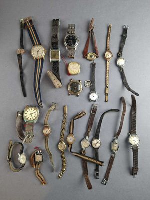 a lot of watches that are sitting on a table