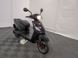 a scooter that is parked in a room