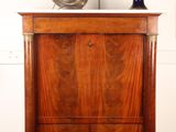 a wooden cabinet with a clock on top of it