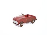 a red toy car that is sitting on a white surface