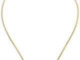 un collier en or avec un pendentif en pierre noire et blanche