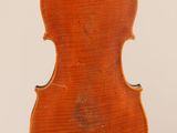 an old violin on a stand with a white background