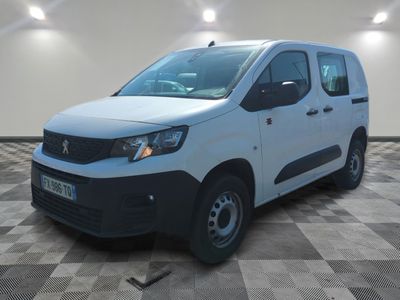 the white van is parked on a checkered floor in a room