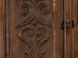 a wooden door with a decorative design on it