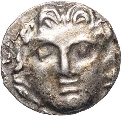 a silver coin with a face of a man on it