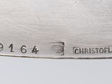 a close up of a silver plate with numbers on it