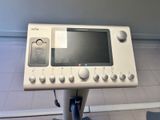 a medical device sitting on a stand in a room