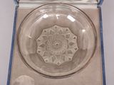 a glass bowl with a design in it in a box