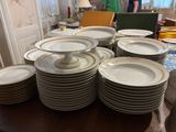 a lot of plates on the table ready to be served