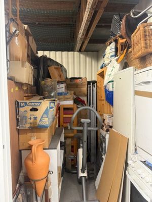 a small room with a lot of boxes and appliances