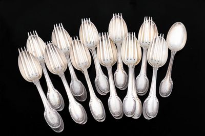 a lot of silver spoons and spoon spoons on a black background