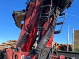 a red truck with a crane on the back of it