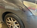 a close up of a car that has been painted silver