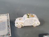 a small toy car next to a plaque on a table