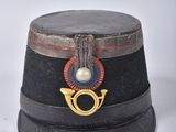 a black hat with a gold ring on it