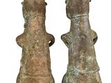 pair of bronze figurines of a man and a woman