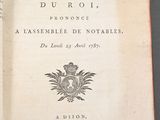 an open book with a picture of a coat of arms on it