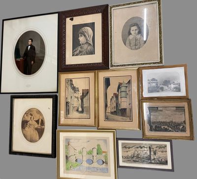 many framed pictures on the wall of this room