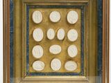 an image of a picture of a gold frame with coins in it