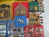 a lot of toy buildings and other items on the table