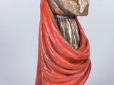 figurine of a man holding a baby and a dog