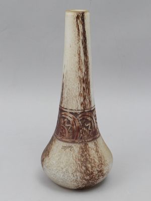 an image of a vase with a brown and white decoration