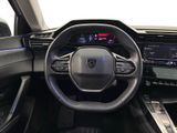 the interior of a car with a steering wheel and dashboard controls