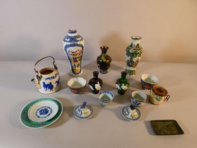 many different types of vases and plates on the table