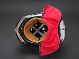 a helmet that has a red cloth on top of it