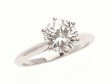 a close up of a diamond ring on a white background