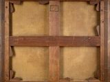 an old suitcase sitting on top of a wooden floor