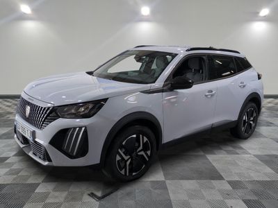 a white suv parked on a checkered floor in a garage