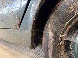 a close up of a dirty tire on a truck