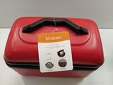 a red suitcase sitting on a table with a price tag on it