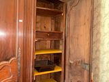 a wooden armoire with shelves and shelves in it