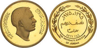 a close up of a gold coin with an image of a man on it