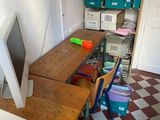 a computer on a desk in a room with a checkered floor