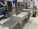 a conveyor belt in the middle of a factory