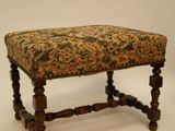an image of a foot stool with a floral upholstered seat