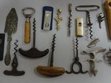 many different types of wine openers on the table