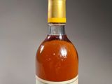 an image of a bottle of wine sitting on top of a table