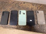 four iphones are lined up in a row on a table