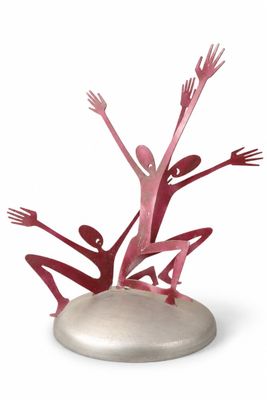 sculpture of a group of people holding hands up in the air