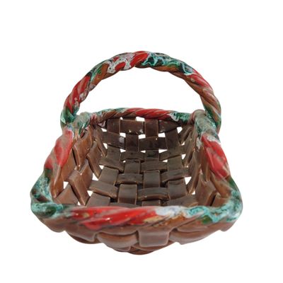 a small basket with a handle on a white background