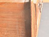 a close up of a wooden drawer on a table